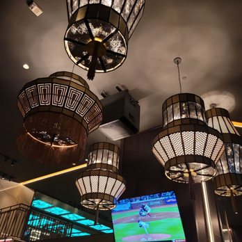 BURN By Rocky Patel - a group of chandeliers hanging from the ceiling - Cigar Bars Near Me - Indianapolis, Indiana BURN By Rocky Patel - a group of chandeliers hanging from the ceiling - Cigar Bars Near Me - Indianapolis, Indiana