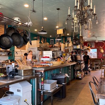 Eye on I - a kitchen with lots of pots and pans - Pizza Near Me - Lompoc, California