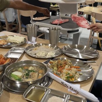 Hello Shabu - robot bringing meat to our table - Pan Asian Near Me - San Bernardino, California