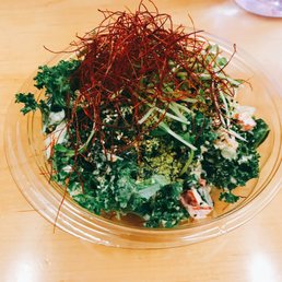 Lei - salmon in togarashi sauce, cucumber, red pepper, avocado,  green onion, red pepper strings, spicy peas, furikake, & microgreens.