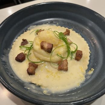 Eurasia Cafe - Ravioli Al Uovo Lemon ricotta, house pancetta, pea shoots, cured egg yolk - New American Near Me - Virginia Beach, Virginia Eurasia Cafe - Ravioli Al Uovo Lemon ricotta, house pancetta, pea shoots, cured egg yolk - New American Near Me - Virginia Beach, Virginia