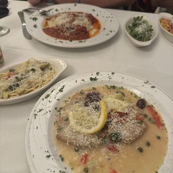 Santioni's Italian Restaurant - Veal Mediterranean with lemon sauce pasta Across veal parm - Italian Near Me - Fleming Island, Florida