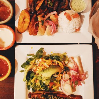 Zarate's Latin Mexican Grill - El lomo saltado with plantains, rice, and sauce. Salmon with salad, avocado, yucca, and marinated onions. - Latin American Near Me - Edmond, Oklahoma Zarate's Latin Mexican Grill - El lomo saltado with plantains, rice, and sauce. Salmon with salad, avocado, yucca, and marinated onions. - Latin American Near Me - Edmond, Oklahoma