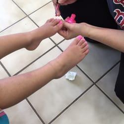 TP Nails & Waxing - Sue putting nail polish on little toes! She is awesome! Check out TP nails for mani/pedi plus more services like waxing.