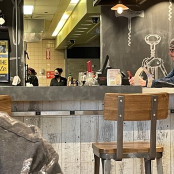 Tap & Pour - Just on the phone visiting in the kitchen. - Airport Lounges Near Me - Reno, Nevada