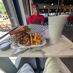 Big ass fish sandwich combo with seasoned fries and grape koolaid. Big ass fish sandwich combo with seasoned fries and grape koolaid.