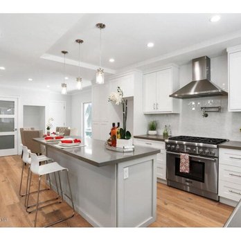 Aria Remodeling - a kitchen with white cabinets and stainless steel appliances - General Contractors Near Me Aria Remodeling - a kitchen with white cabinets and stainless steel appliances - General Contractors Near Me