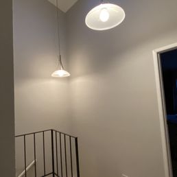 Second story hallway and stairs. They did a fantastic job cutting in at the ceiling. Second story hallway and stairs. They did a fantastic job cutting in at the ceiling.