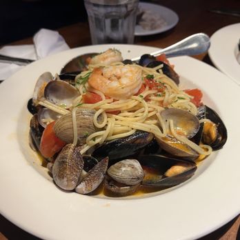 La Vita E Bella - Spaghetti di Mare Homemade spaghetti tossed with tiger prawns, clams, mussels, Roma tomatoes, garlic & white wine - Italian Near Me - Seattle, Washington La Vita E Bella - Spaghetti di Mare Homemade spaghetti tossed with tiger prawns, clams, mussels, Roma tomatoes, garlic & white wine - Italian Near Me - Seattle, Washington