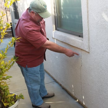 Josh Hinkey, P.E. - Consulting Structural Engineering - Jim pointing to a large stucco crack. - Structural Engineers Near Me - Loomis, California Josh Hinkey, P.E. - Consulting Structural Engineering - Jim pointing to a large stucco crack. - Structural Engineers Near Me - Loomis, California