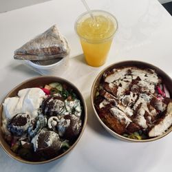 Bowl & Wrap - Falafel bowl on the left. Chicken cream chop on right. Lentil soup and fresh squeezed orange juice on top.
