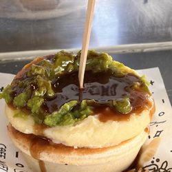 Harry's Cafe de Wheels - Woolloomooloo - Tiger Pie has a tender meat filling and topped with mashed potatoes, mushy peas, and gravy