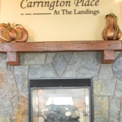 Carrington Place Apartments by Greystar - Cozy up by the fire in the clubhouse