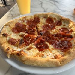 Pepperoni pizza with Allagash White beer