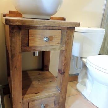 Ezra Builders - a bathroom with a sink and toilet - General Contractors Near Me