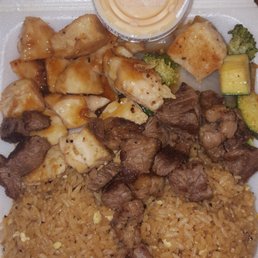 Steak and chicken with fried rice, yum yum sauce, and habichi veggies Steak and chicken with fried rice, yum yum sauce, and habichi veggies