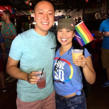 Alibi - a man and a woman holding drinks - Dive Bars Near Me - San Diego, California Alibi - a man and a woman holding drinks - Dive Bars Near Me - San Diego, California