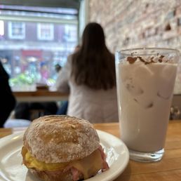 Ham and egg sandwich with iced chai latte Ham and egg sandwich with iced chai latte