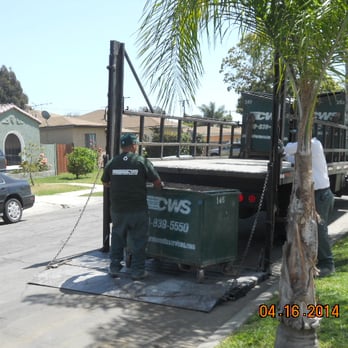 California Waste Services - 1 yard dumpster filled to the brim with dirt rolled onto the truck for pickup. - Dumpster Rental Near Me - Gardena, California California Waste Services - 1 yard dumpster filled to the brim with dirt rolled onto the truck for pickup. - Dumpster Rental Near Me - Gardena, California