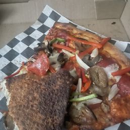 Burnt old pizza. Horrible! Burnt old pizza. Horrible!