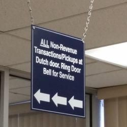 US Post Office - Sign pointing to Non-Revenue Transactions door
