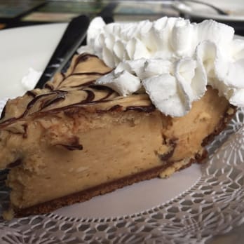 Riverside Cafe - Their famous Peanut Butter Cheesecake, this time for free as a birthday cake. Smooth, rich but not filling. - Sports Bars Near Me - Vero Beach, Florida Riverside Cafe - Their famous Peanut Butter Cheesecake, this time for free as a birthday cake. Smooth, rich but not filling. - Sports Bars Near Me - Vero Beach, Florida