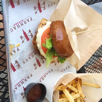 Farmhaus Burger - Chicken burger on a wheat bun with tomato, American, & lettuce. Side of salt and pepper fries. - Burgers Near Me - Augusta, Georgia