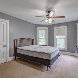 Miami Redhawks Properties - Large Bedroom with Bay Windows and walk-in closet. Fully Furnished. To be updated summer 2022 to remove carpeting.