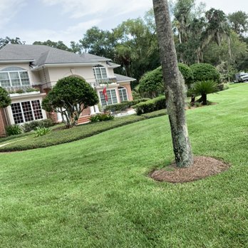Lawns By JL - a house and a tree - Lawn Services Near Me Lawns By JL - a house and a tree - Lawn Services Near Me