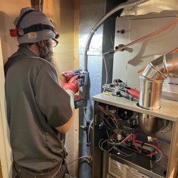 Ultimate Heating, Cooling, Plumbing & Electric - Technician working on HVAC - Heating & Air Conditioning/HVAC Near Me - Denver, Colorado Ultimate Heating, Cooling, Plumbing & Electric - Technician working on HVAC - Heating & Air Conditioning/HVAC Near Me - Denver, Colorado