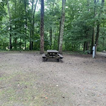 Hopeville Pond State Park - Right side of site F09. Picnic table is pictured along with a 20/30/50 amp outlet and water spigot. Bathrooms are located right behind. - Parks Near Me - Griswold, Connecticut