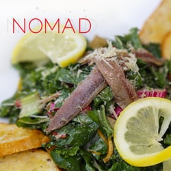 Nomad Kitchen and Lounge - ORGANIC KALE AND CHARD CAESAR varietal kale and chard greens, with our house made caeser and croutons with shaved, aged parmesan