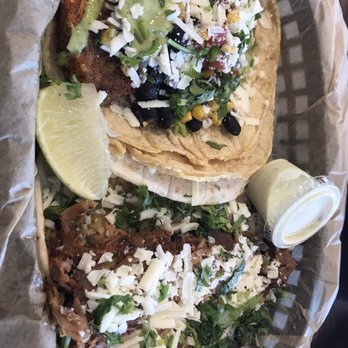 Torchy's Tacos - Mr. Orange-blackened salmon (left) Green Chile-pork (right) - Tacos Near Me - Pflugerville, Texas