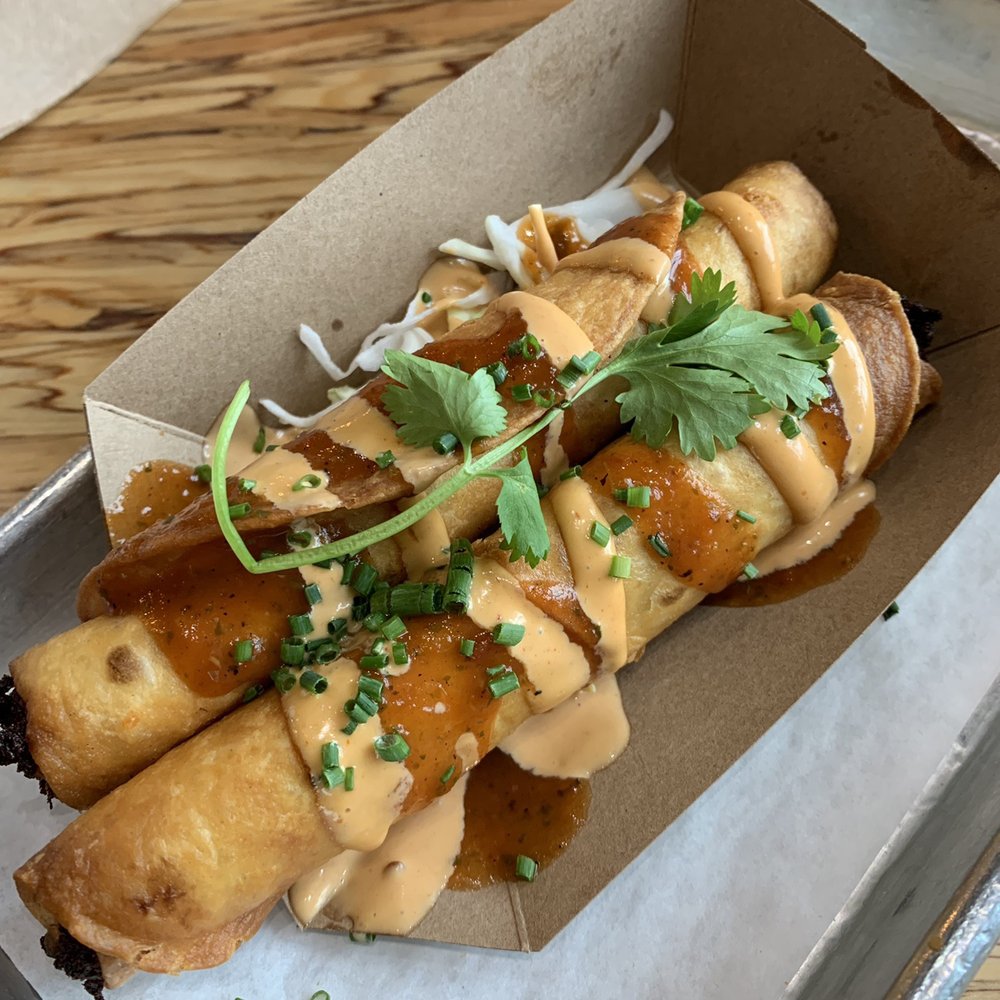 Slapfish - Lobster Taquitos (sauce on top has a kick) 2 Pieces Lobster Taquitos - Seafood Near Me - Lehi, Utah Slapfish - Lobster Taquitos (sauce on top has a kick) 2 Pieces Lobster Taquitos - Seafood Near Me - Lehi, Utah