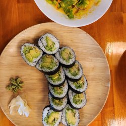 Amura Sushi Cafe - Avocado + cucumber rolls and small house salad.