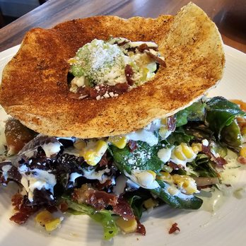 Asado Life - Street Corn salad with an interestinh round chile covered crisp on top - New American Near Me - Saint Augustine, Florida