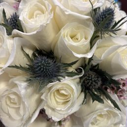 A beautiful bouquet also with thistles to match the boutonnieres A beautiful bouquet also with thistles to match the boutonnieres