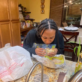 Loco Burrito - My niece enjoying her California burrito... - Mexican Near Me - Moreno Valley, California Loco Burrito - My niece enjoying her California burrito... - Mexican Near Me - Moreno Valley, California