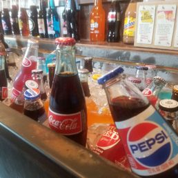Glass bottled sodas on ice Glass bottled sodas on ice