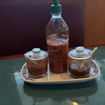 Red Orchid Thai Cuisine - Hot sauce tray - Thai Near Me - McDonough, Georgia Red Orchid Thai Cuisine - Hot sauce tray - Thai Near Me - McDonough, Georgia