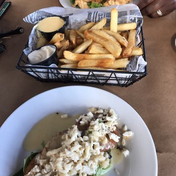 Nicks Fish House - Fried green tomatoes topped with crabmeat, fries with old bay and chicken tenders. - Seafood Near Me - Baltimore, Maryland Nicks Fish House - Fried green tomatoes topped with crabmeat, fries with old bay and chicken tenders. - Seafood Near Me - Baltimore, Maryland