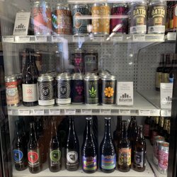 Elevated Beer Wine & Spirits - Nice selection of crowlers in the fridge!
