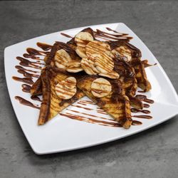 Sweet Mamas Restaurant - The banana foster French toast menu photo, why does my pancake not look like this ?