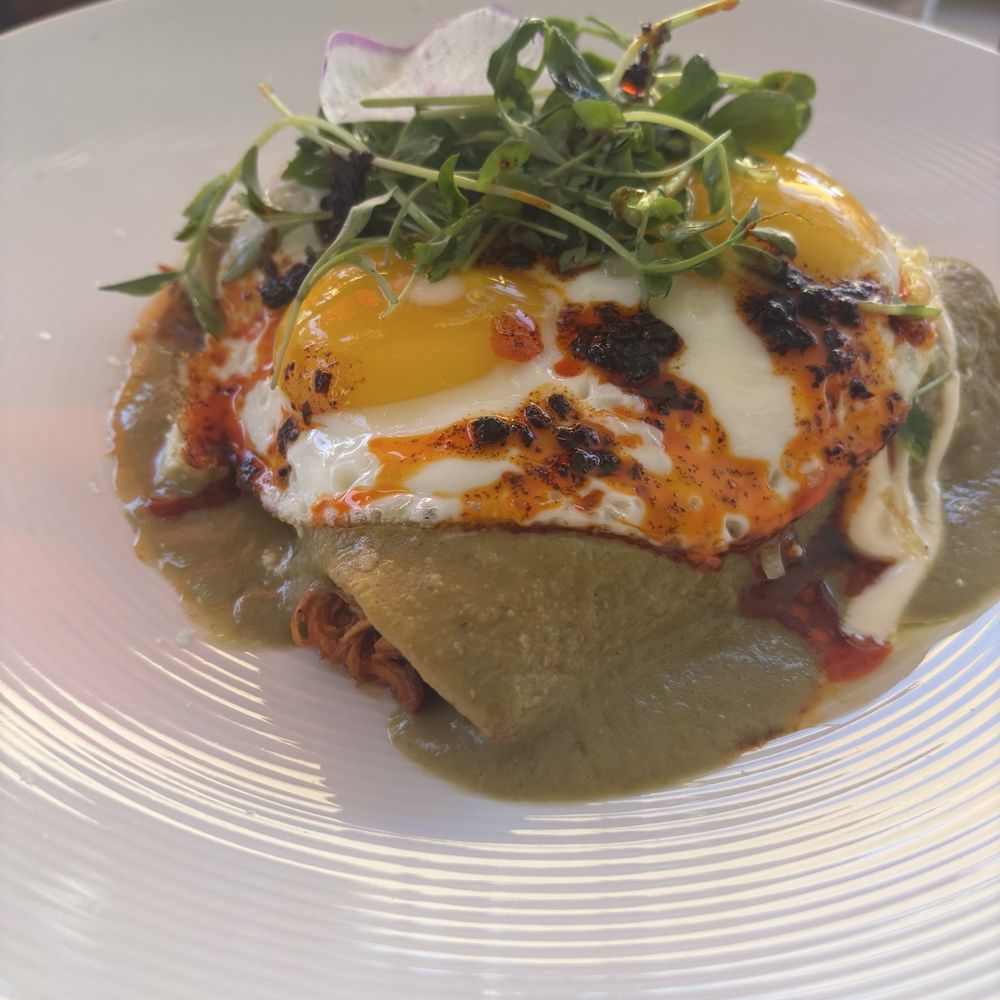 Toro Bravo - Breakfast enchiladas (I added extra salsa from the appetizer) - Steakhouses Near Me - Reno, Nevada