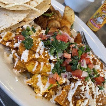 Table 57 - Chili quiles - Breakfast & Brunch Near Me - Visalia, California Table 57 - Chili quiles - Breakfast & Brunch Near Me - Visalia, California