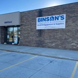 Binson's Medical Equipment and Supplies - Exterior storefront of the Flint, MI location, showing the Binson's Prosthetics & Orthotics sign on a brick building with the...