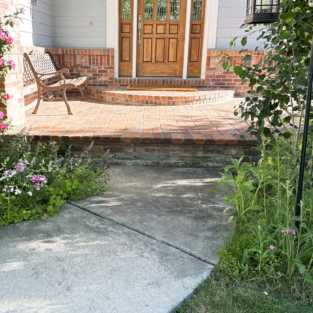 Masonry Restoration - See the drop from the porch to the sidewalk? The sidewalk settled the height of 2 bricks! - Stucco Services Near Me - Aurora, Colorado