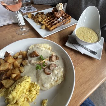 STIR - Sausage gravy biscuit with scrambled eggs and potatoes. A bowl of cheese grits and chicken and waffles. - Cocktail Bars Near Me - Chattanooga, Tennessee STIR - Sausage gravy biscuit with scrambled eggs and potatoes. A bowl of cheese grits and chicken and waffles. - Cocktail Bars Near Me - Chattanooga, Tennessee