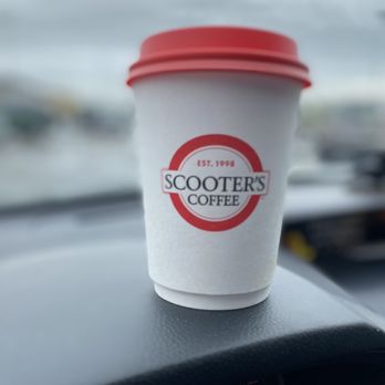 Scooter's Coffee - a coffee cup on the dashboard of a car - Coffee & Tea Near Me - Sweetwater, Tennessee Scooter's Coffee - a coffee cup on the dashboard of a car - Coffee & Tea Near Me - Sweetwater, Tennessee