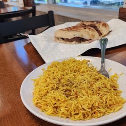 Lunch at Coxmo One.  A plate of yellow rice and a separate plate of beef-lamb shawarma.
